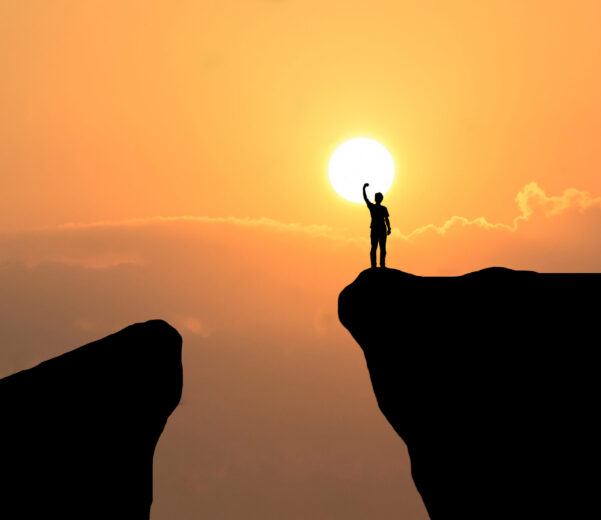 man on top of mountain ,freedom man on sunset